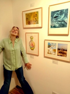 sam with her artwork at the exhibition